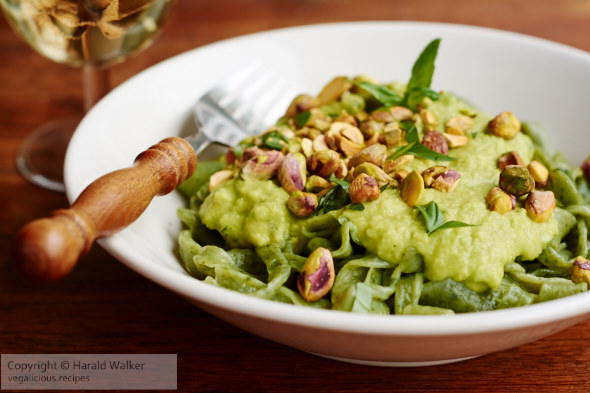 Spinach pasta with avocado pesto and pistachios