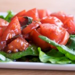 Spinach salad with mulled wine tomatoes