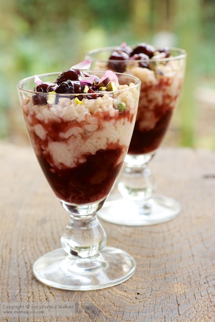 Cinnamon rice pudding with cherry compote and pistachios